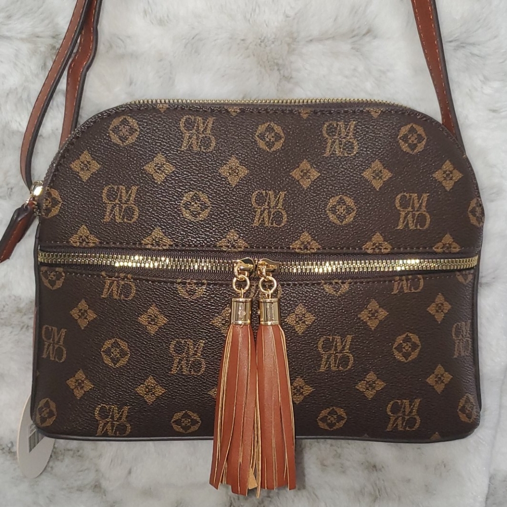 Brown and beige tassel crossbody purse.